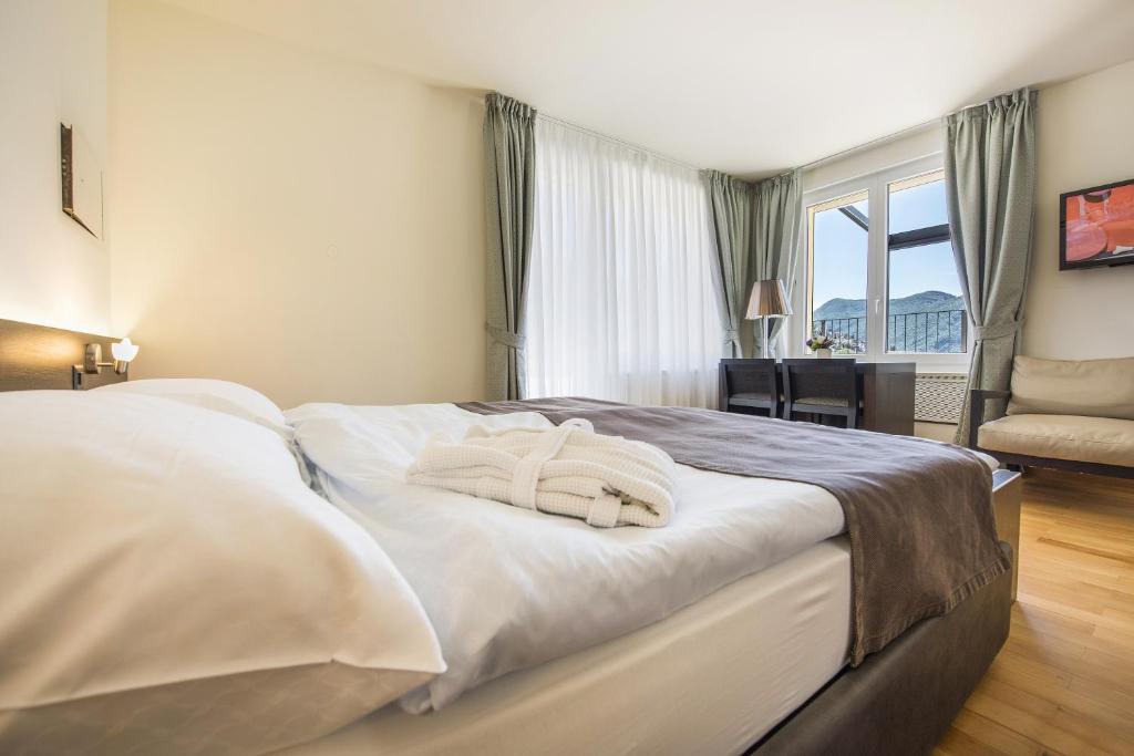 Voodi või voodid majutusasutuse Hotel Walter Au Lac toas