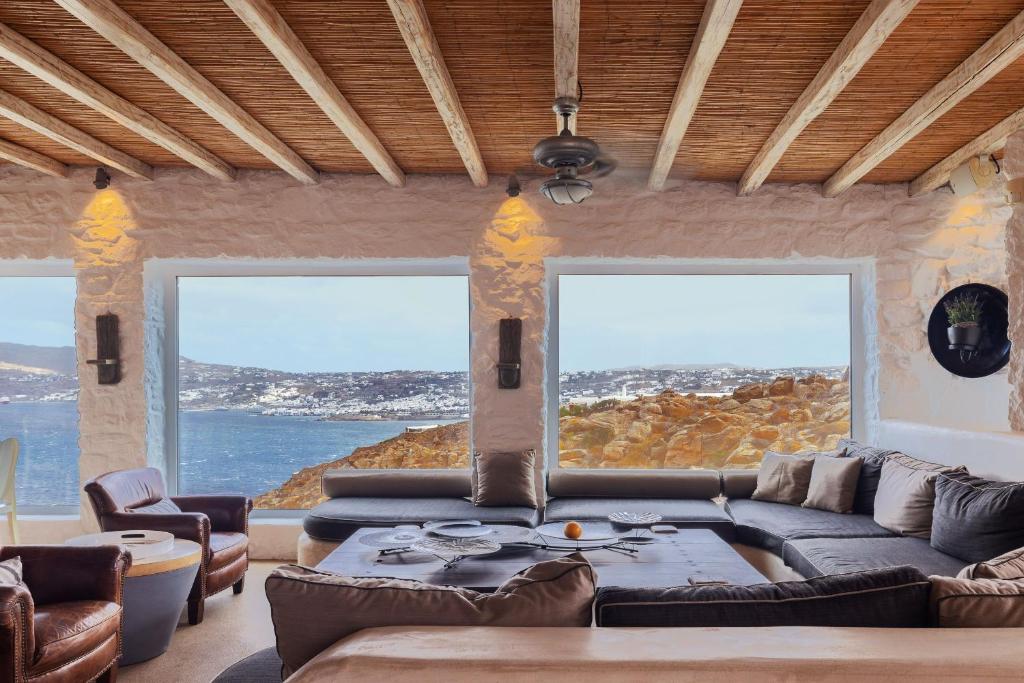 a living room with a couch and a table at Your Mykonos in Mýkonos City