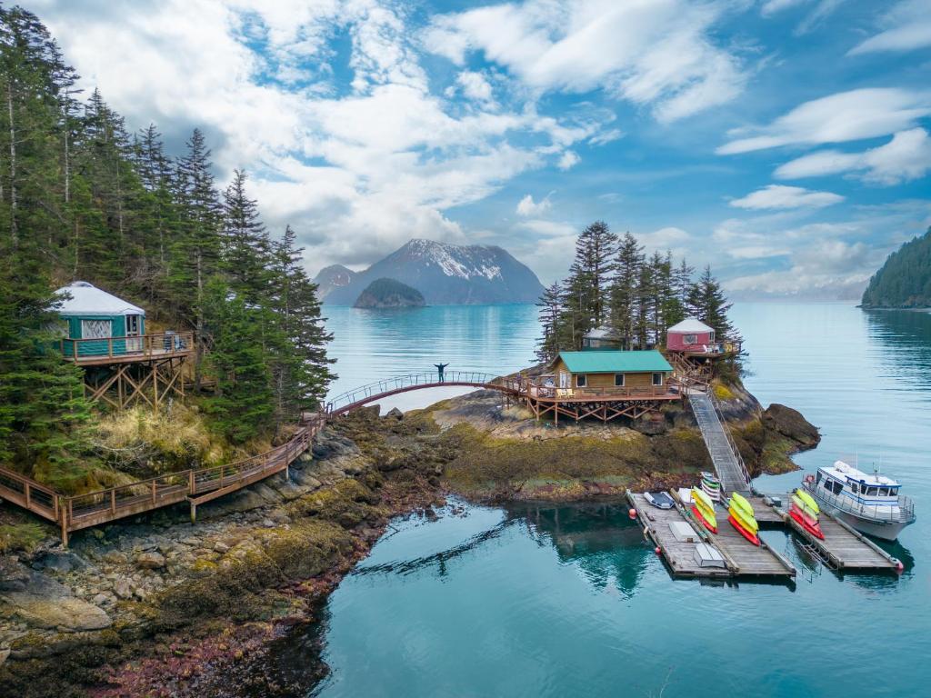 a group of boats on a dock in the water at Orca Island Cabins in Seward