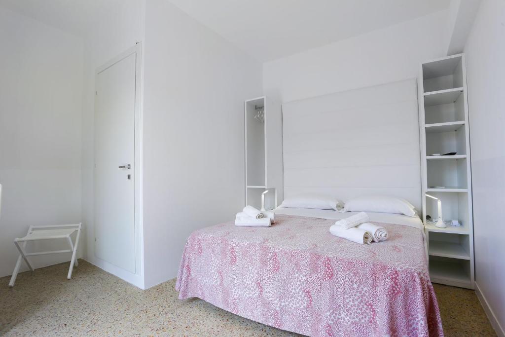 Postel nebo postele na pokoji v ubytování Hotel Ninfea Cattolica