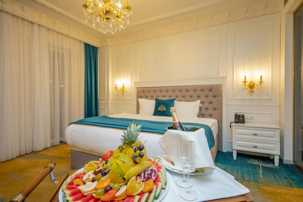 Cama o camas de una habitaci&oacute;n en Grand Hotel Belushi