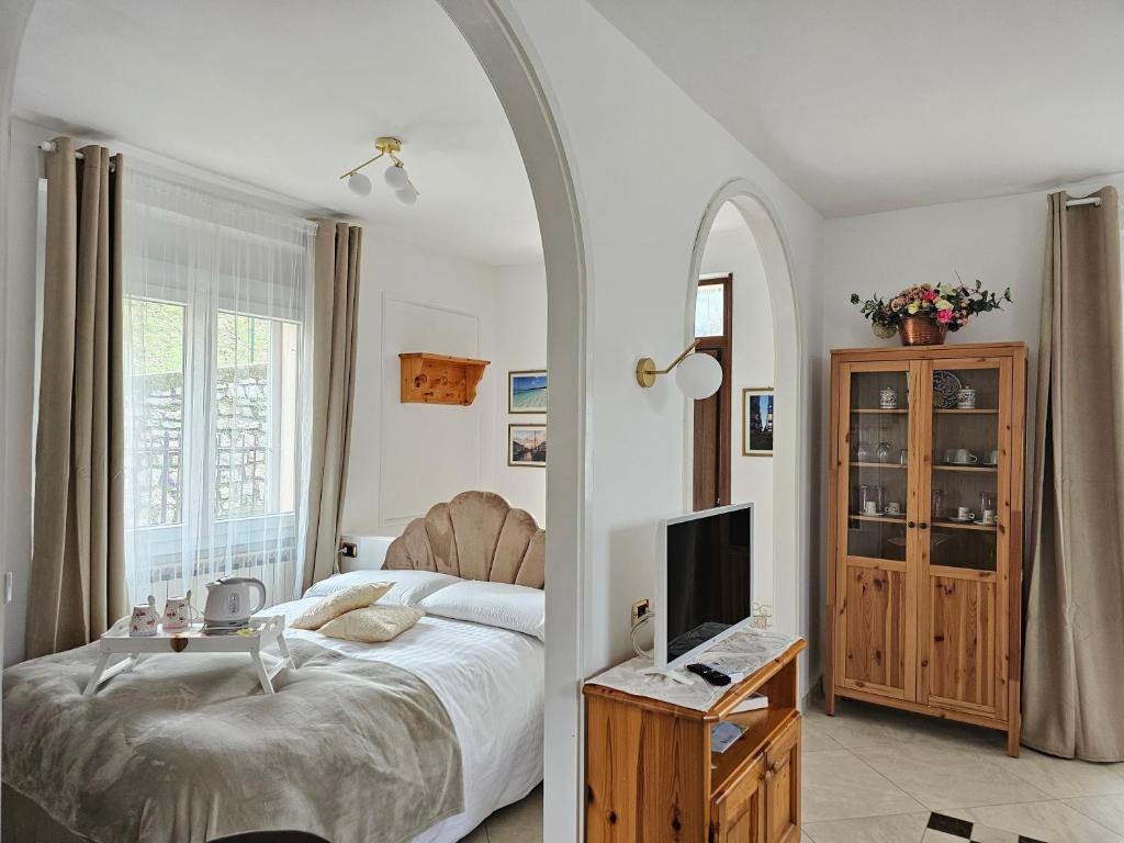 Televízia a/alebo spoločenská miestnosť v ubytovaní Bellagio Rotonda apartment