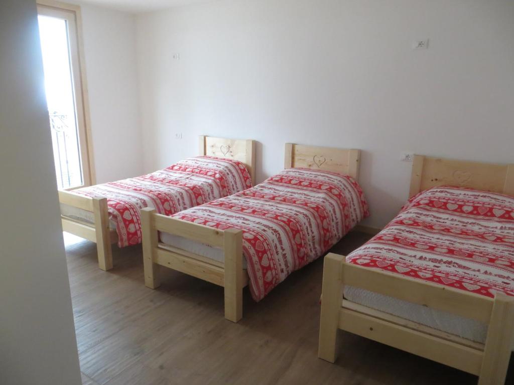 A bed or beds in a room at Olimpic Hostel