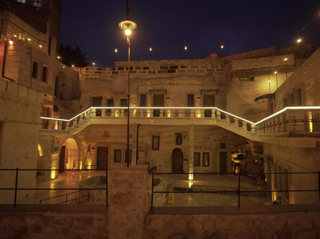 an old building with a bridge in the night at Lost City Cappadocia in Nar