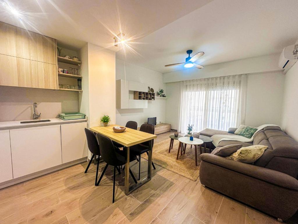 a kitchen and a living room with a couch and a table at La Mata dream in La Mata