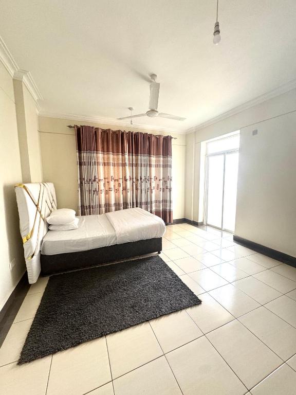 Postel nebo postele na pokoji v ubytování Hillsview Apartment
