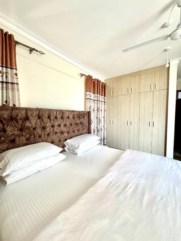 Postel nebo postele na pokoji v ubytování Hillsview Apartment
