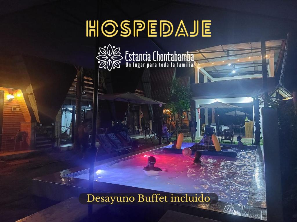 a magazine picture of a pool with people in it at Estancia Chontabamba - Cabañas, Departamento y Habitaciones in Oxapampa