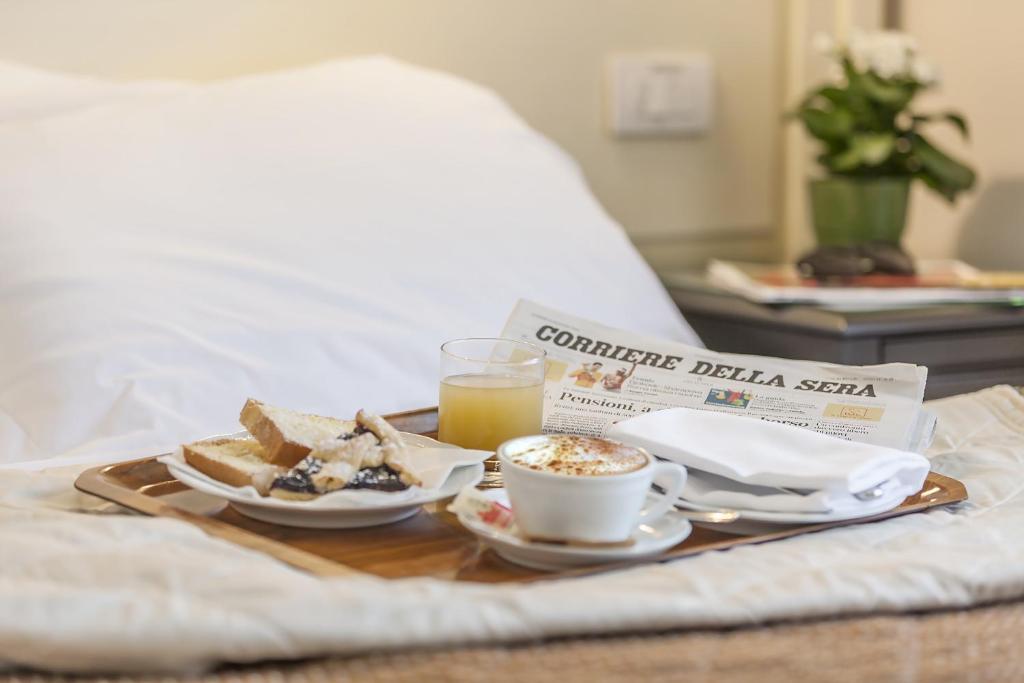 Postel nebo postele na pokoji v ubytování Grand Hotel Bonanno