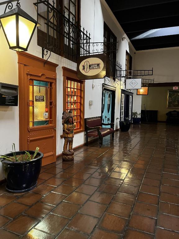 a lobby of a building with a large tile floor at Ramada by Wyndham Las Cruces Hotel & Conference Center in Las Cruces