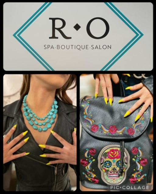 a woman with yellow nails and a purse with a skull on it at Ramada by Wyndham Las Cruces Hotel & Conference Center in Las Cruces
