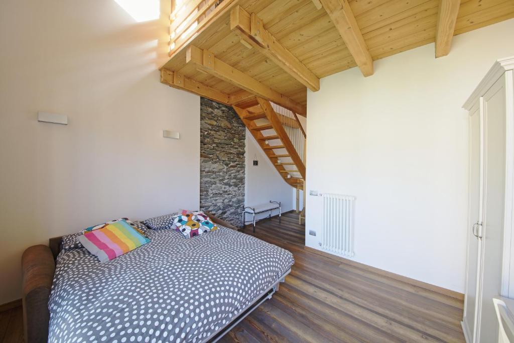 Łóżko lub łóżka w pokoju w obiekcie La Corte di Nonna Gemma - Holiday Home