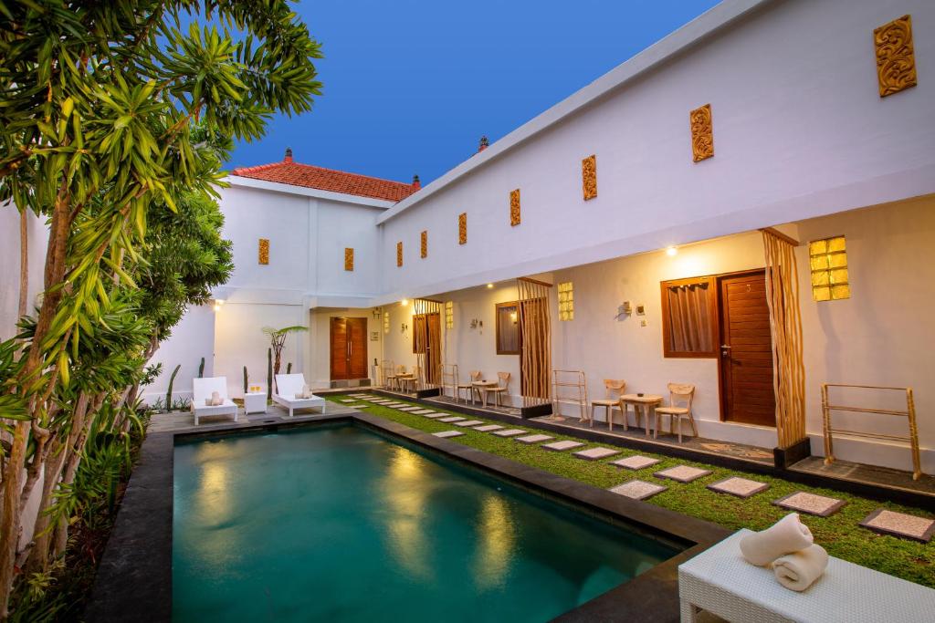 an external view of a villa with a swimming pool at Maisaba Seminyak Loft & Villas in Seminyak