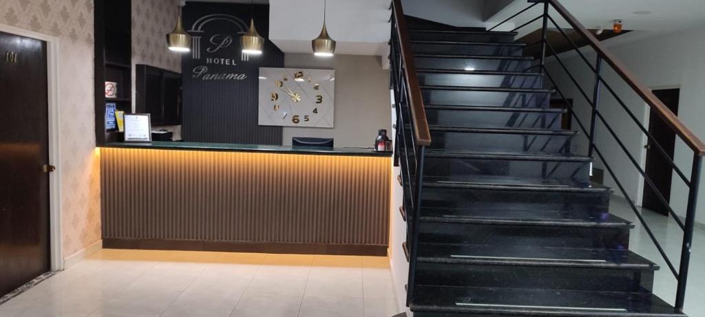 a staircase leading up to a bar in a restaurant at Hotel Panama in Neiva