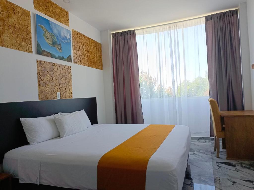 Postel nebo postele na pokoji v ubytování Patty House Galapagos