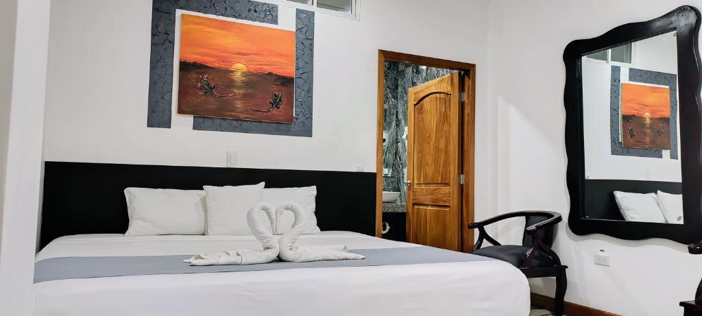Postel nebo postele na pokoji v ubytování Patty House Galapagos