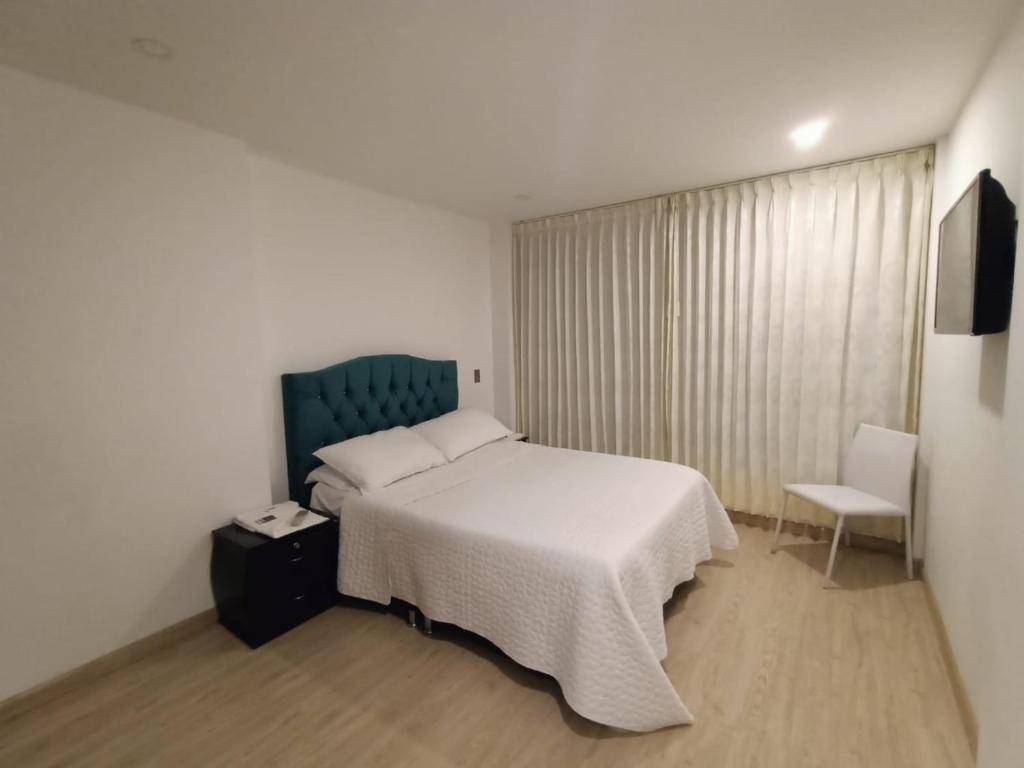 Postel nebo postele na pokoji v ubytování Hospedaje Tunja