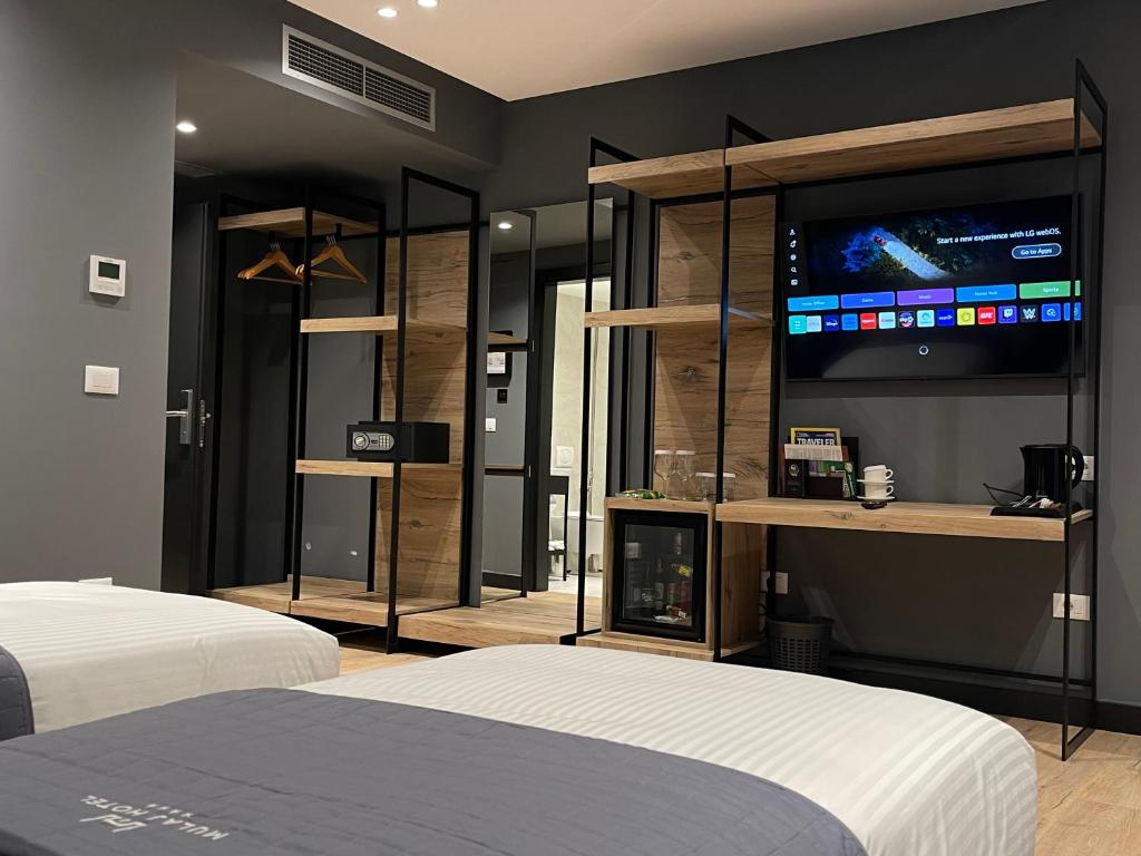 Una cama o camas en una habitación de Mulaj Hotel