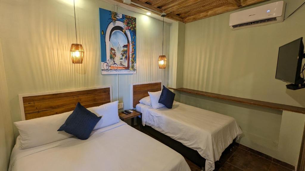 Voodi või voodid majutusasutuse Maloka Boutique Hostel toas