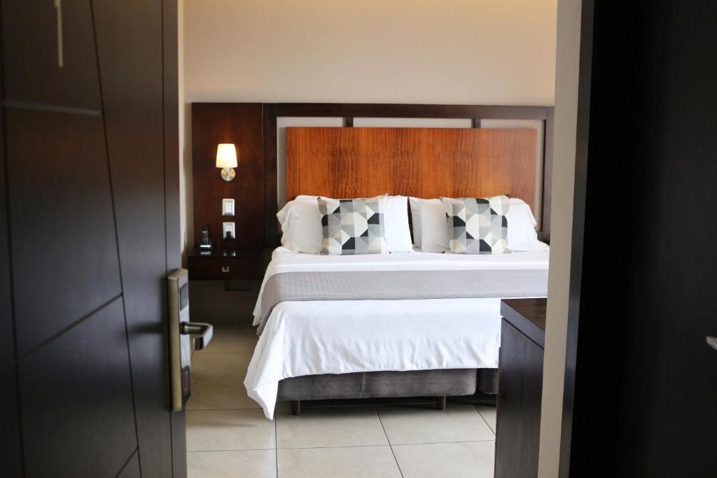 Postel nebo postele na pokoji v ubytování Hotel Perla Spondylus