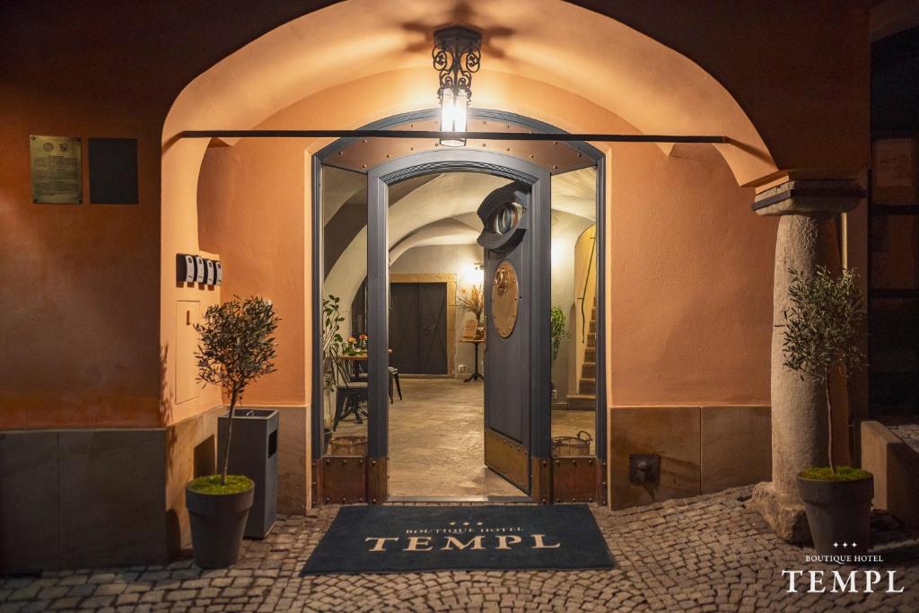 an entrance to a building with a glass door at Boutique Hotel Templ in Mikulov