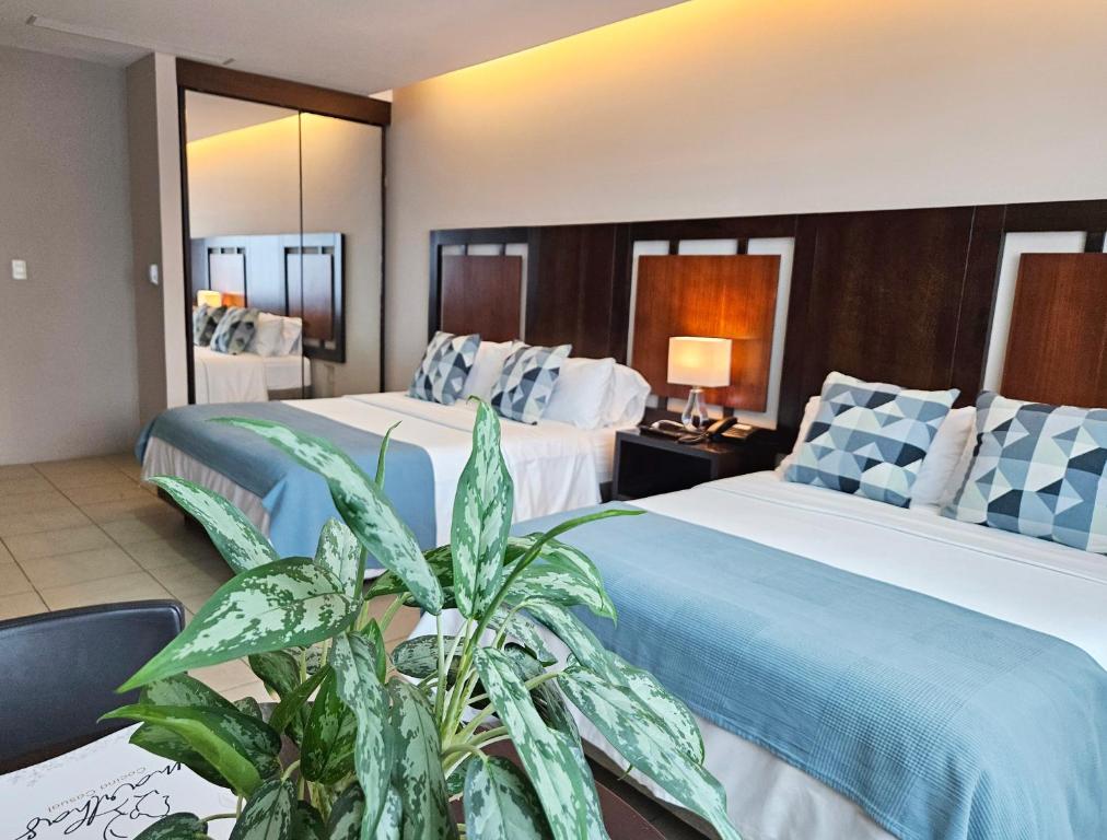Postel nebo postele na pokoji v ubytování Hotel Perla Spondylus