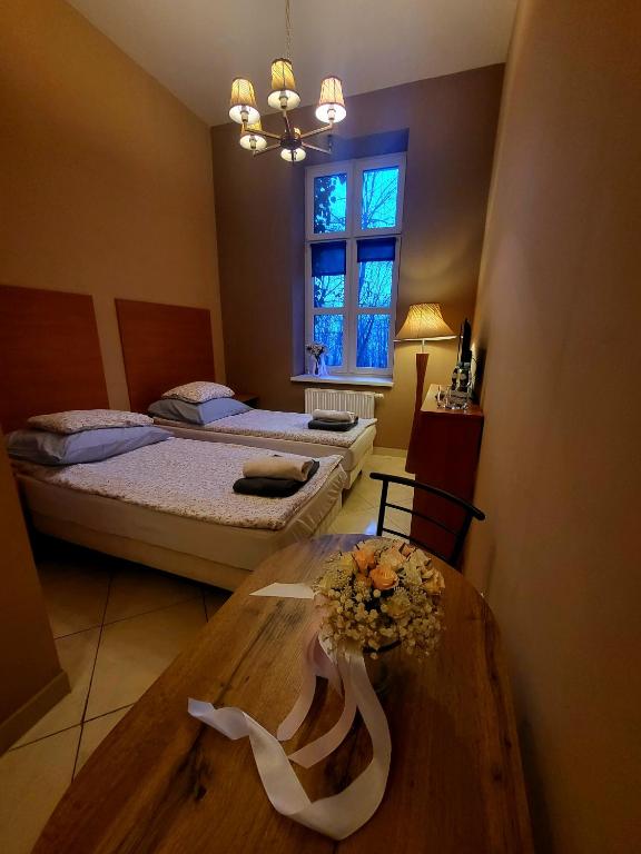 Postel nebo postele na pokoji v ubytování Kasztanowy Dwór