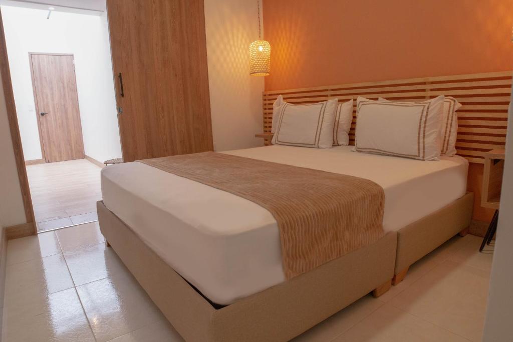Postel nebo postele na pokoji v ubytování La Casona Hotel Boutique