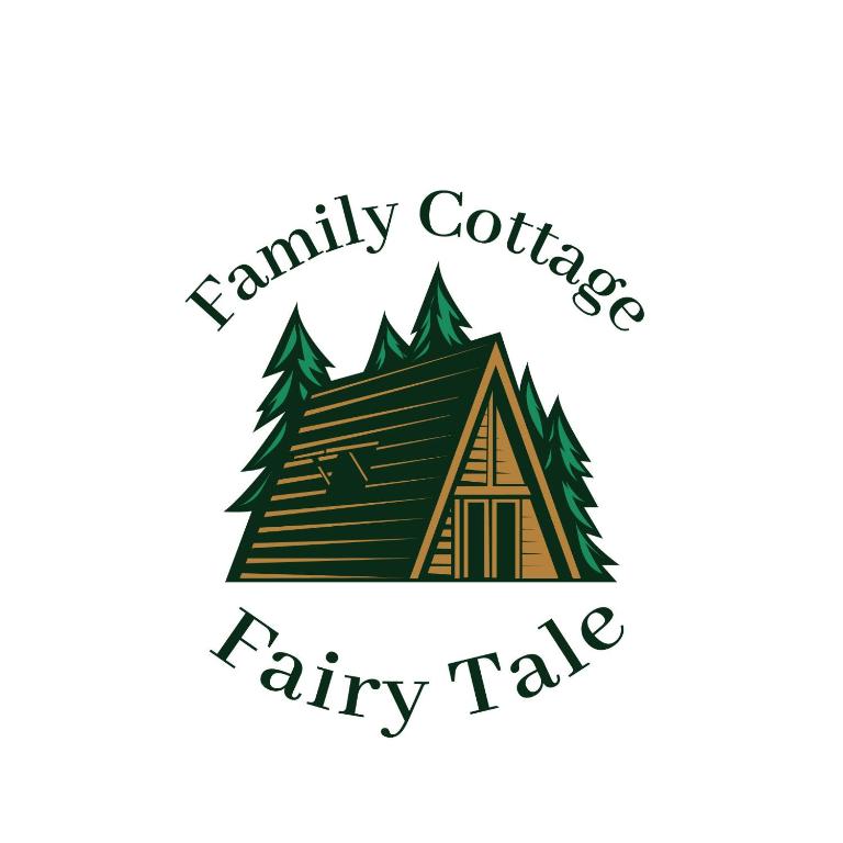 eine Hütte mit Bäumen und den Worten Familienkragen Märchen in der Unterkunft Family cottage Fairy tale in Banja Luka