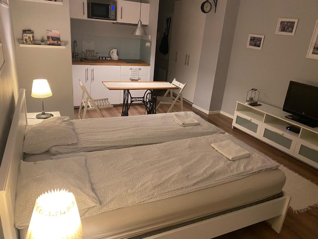 Postel nebo postele na pokoji v ubytování B&B Apartman Eger