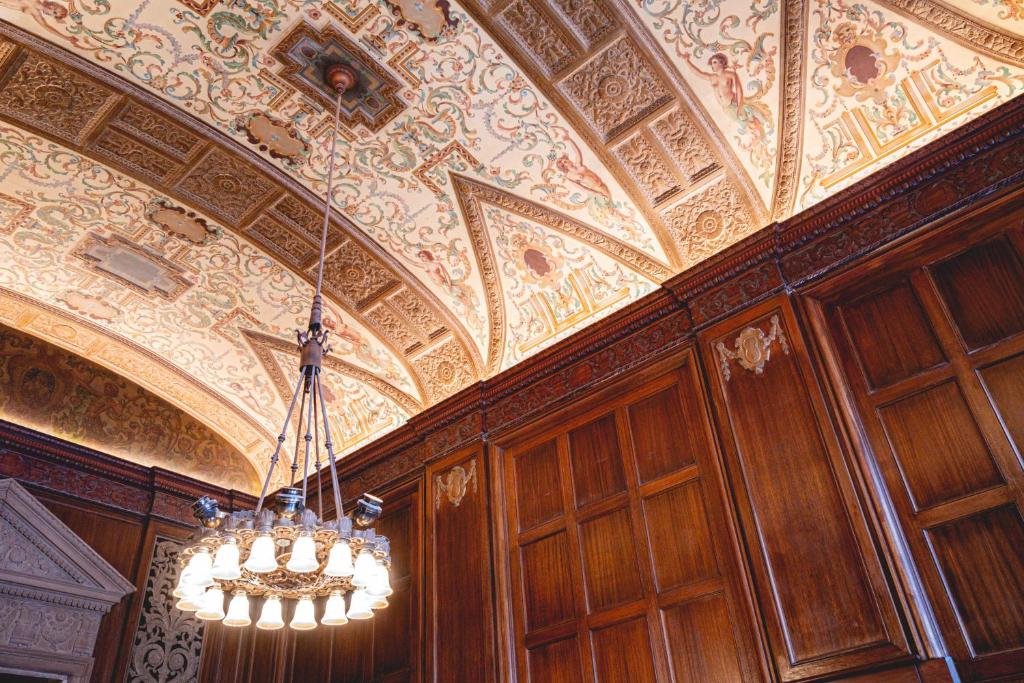 a chandelier hanging from a ceiling in a room at Beacon Grand, A Union Square Hotel in San Francisco