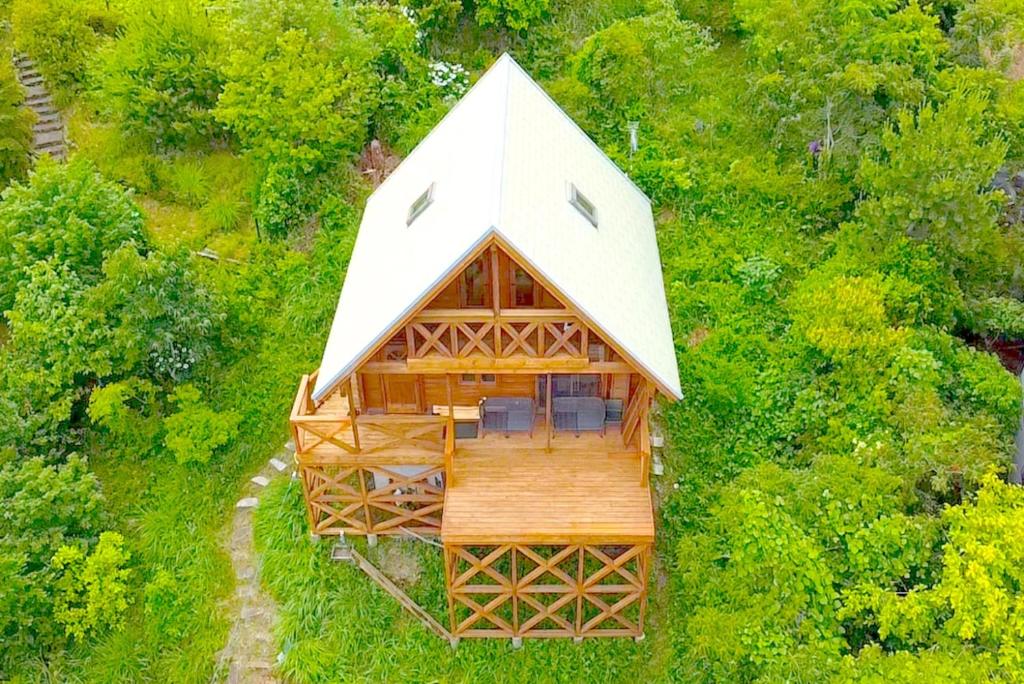 an overhead view of a cabin with a white roof at Spa&View COZY HOUSE - Vacation STAY 36902v in Okawa