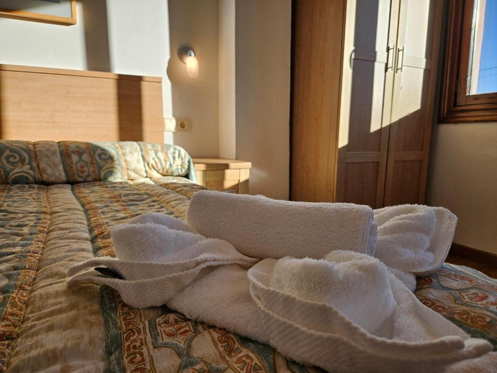 Postel nebo postele na pokoji v ubytování 17C01 Apartamento Caravia
