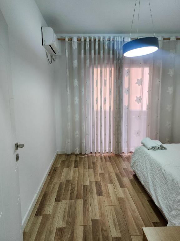 Cama o camas de una habitación en 2E Apartment Myslym Shyri