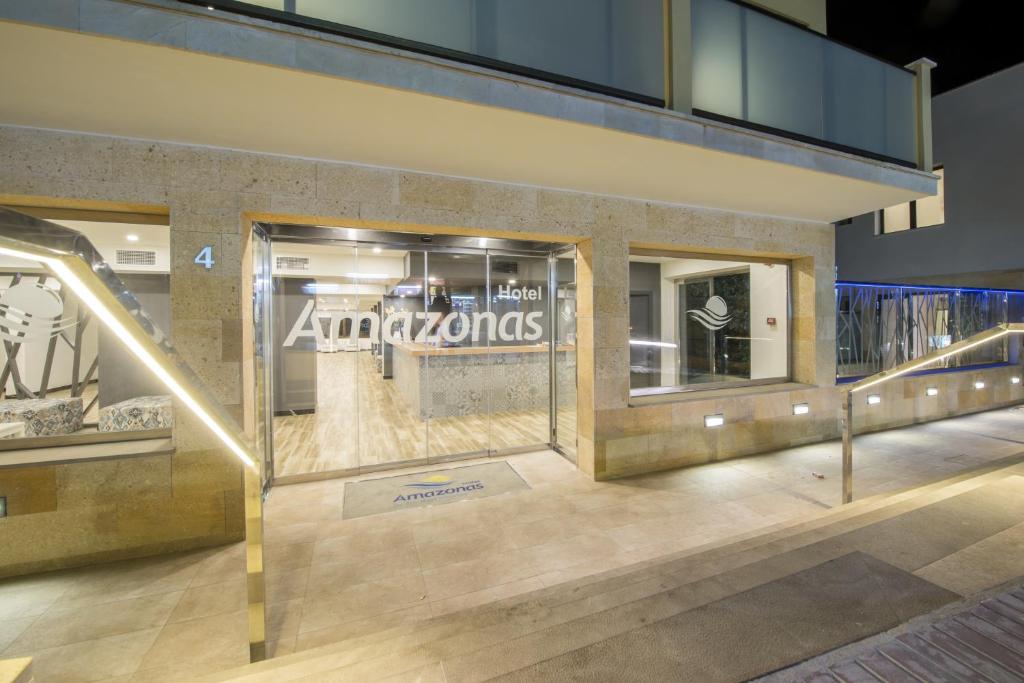 a store front with a store sign on the window at Hotel Amazonas in El Arenal