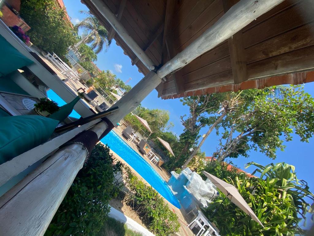 a view of the pool at a resort at D' Franchesis Hostal in Juan Dolio