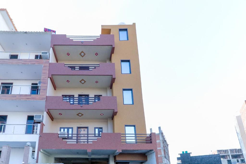 a building with balconies on the side of it at OYO Mastic Marvell in Noida