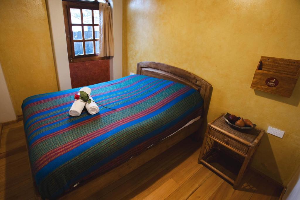 Postel nebo postele na pokoji v ubytování Llullu Llama Mountain Lodge