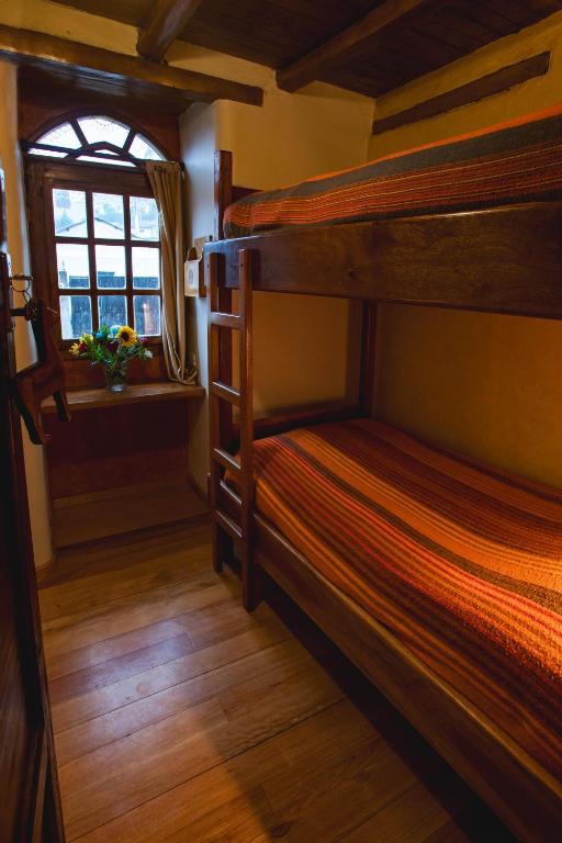 Postel nebo postele na pokoji v ubytování Llullu Llama Mountain Lodge