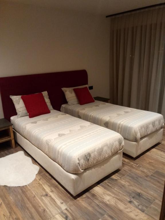 A bed or beds in a room at Baita Ricky