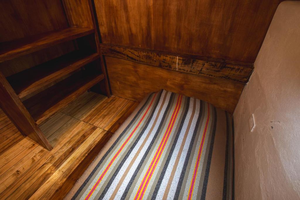 Postel nebo postele na pokoji v ubytování Llullu Llama Mountain Lodge