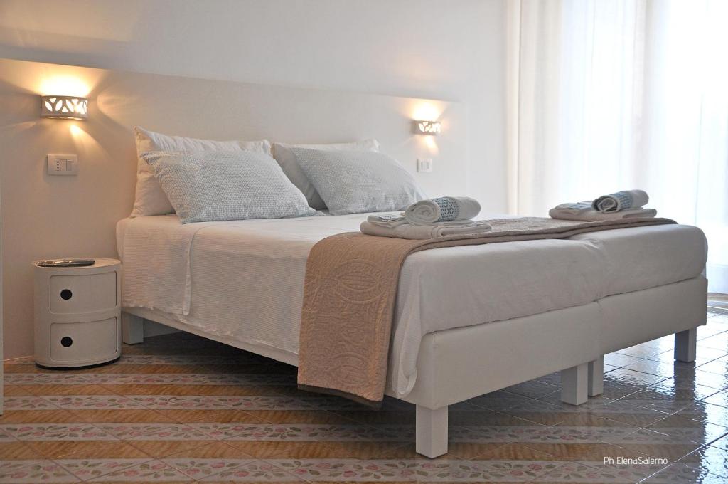 Postel nebo postele na pokoji v ubytování Agorà b&b