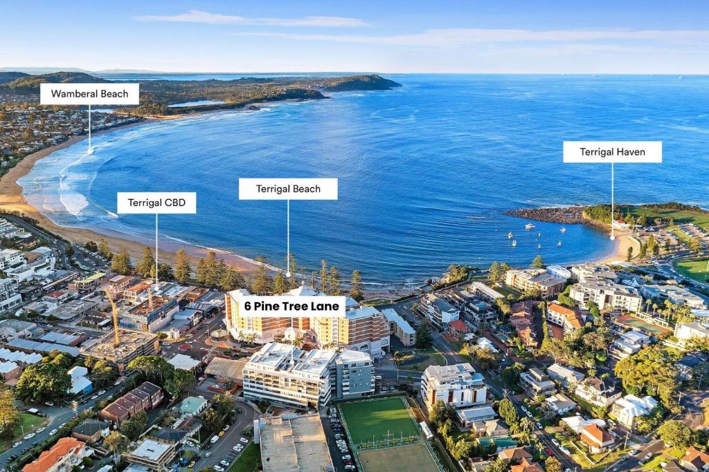 an aerial view of a city and the ocean at Modern & Cozy Unit Just Steps from Terrigal Beach in Terrigal