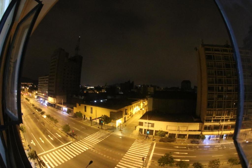 a view from a window of a city at night at El Lugar más Centrico de Lima in Lima