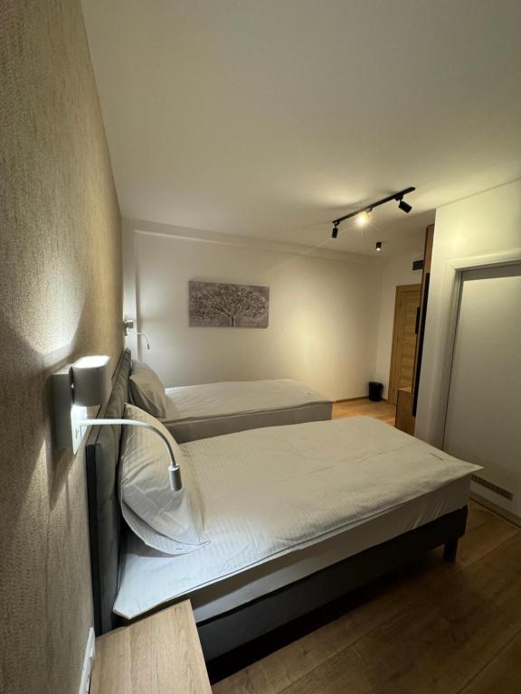 Postel nebo postele na pokoji v ubytování Triangle Rooms