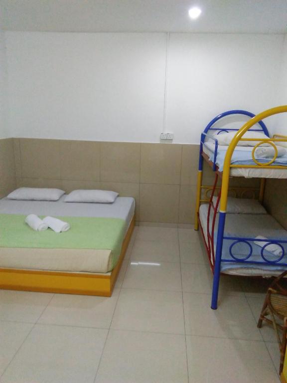 Postel nebo postele na pokoji v ubytování Hotel Abby IGB Tasek
