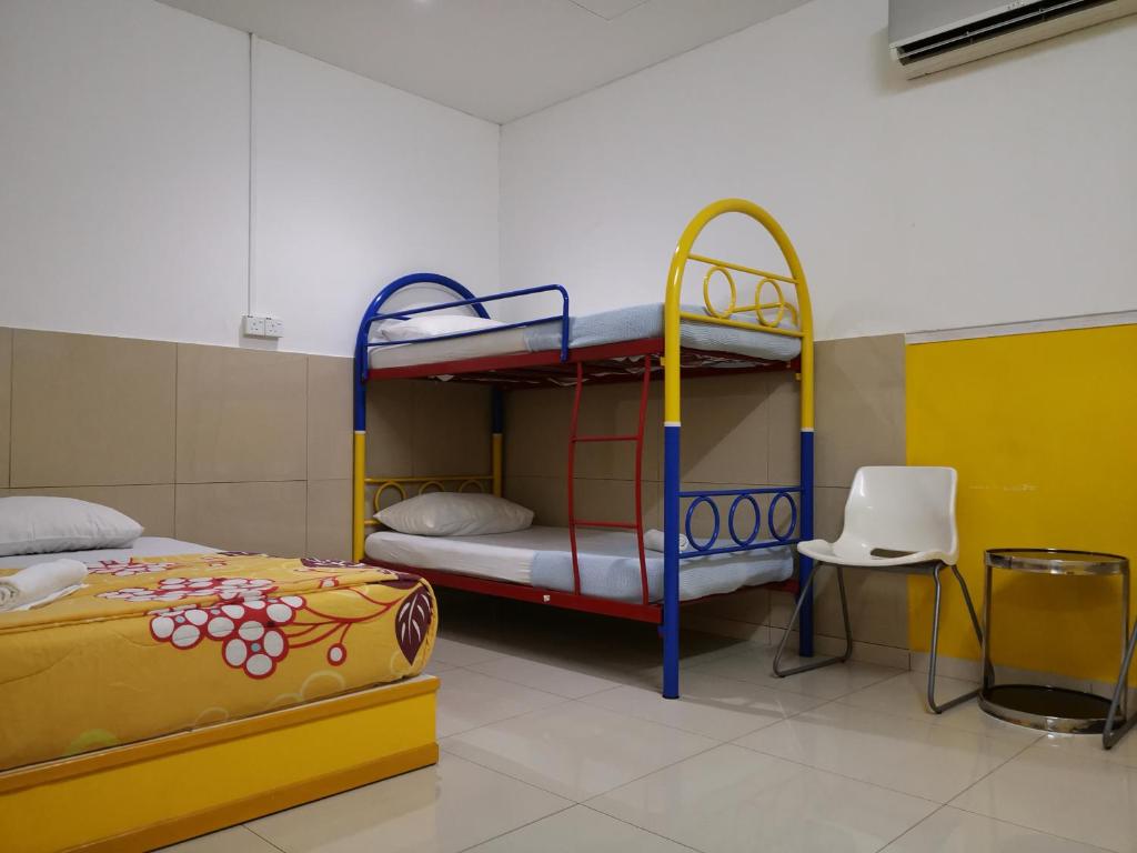 Postel nebo postele na pokoji v ubytování Hotel Abby IGB Tasek