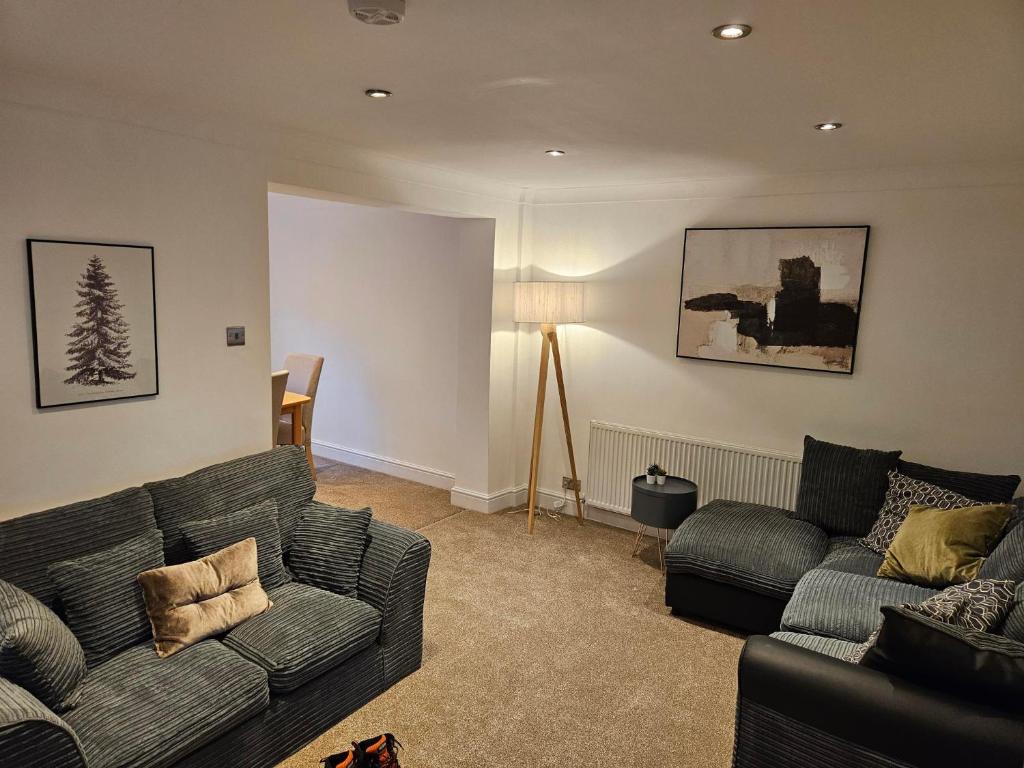 a living room with a couch and two couches at 3 Severn close Contractor home in Oakham in Oakham
