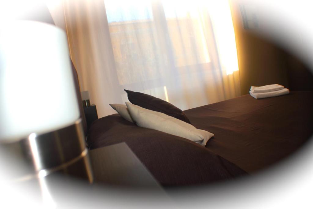 Postel nebo postele na pokoji v ubytování Domus Corso Umberto 18 B&B