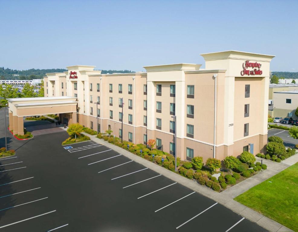 an aerial view of a hotel with a parking lot at Hampton Inn & Suites by Hilton Seattle/Kent in Kent